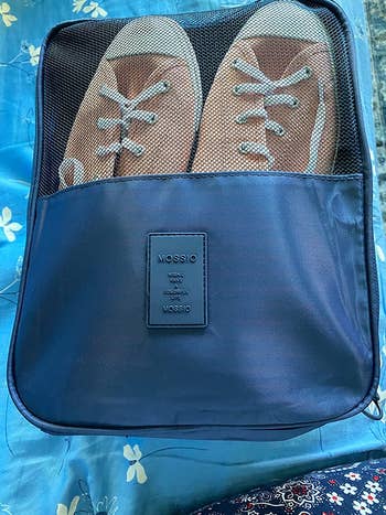 same reviewer's bag zipped shut with shoes inside