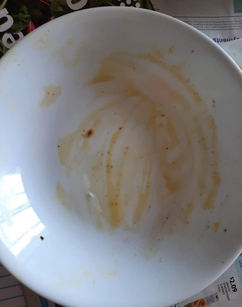 reviewer photo of a white bowl with food residue on it
