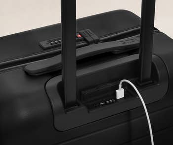 close up of the usb charger on the carry on in black