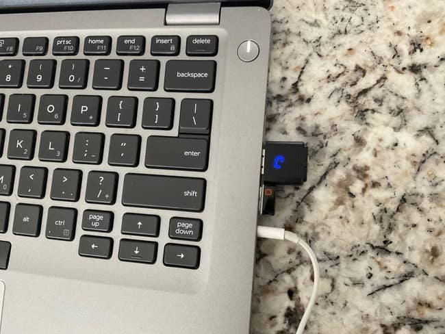 Laptop with USB mouse mover attached