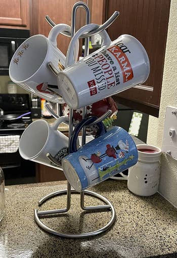 reviewer photo of mugs on metal mug holder
