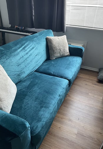 same couch recovered with teal velvet cover