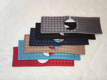 Closeup of sink drip guards in red, blue, tan, navy blue, black, and gray