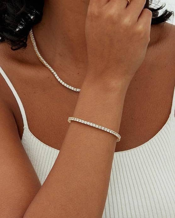 A exemplary wearing matching necklace and bracelet with cubic zirconia stones, featuring a ribbed sleeveless top