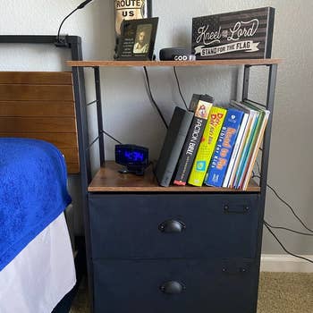 reviewer photo of nightstand with tall platform next to bed