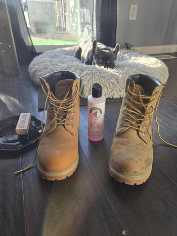 reviewer's boots broadside by side, 1 soiled and 1 cleanable with the cleaner and brushwood beside them