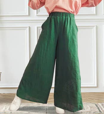 model wearing green linen culottes