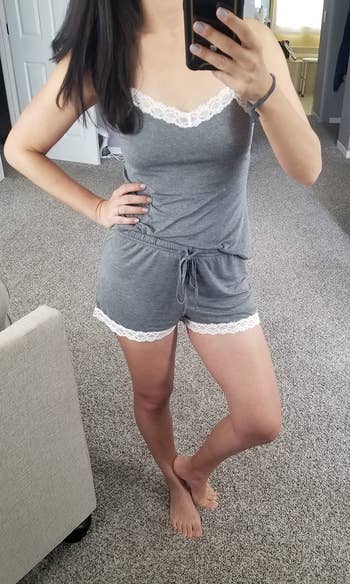 Person taking a reflector selfie, wearing a comfy lace-trimmed, sleeveless apical and shorts set, perfect for lounging