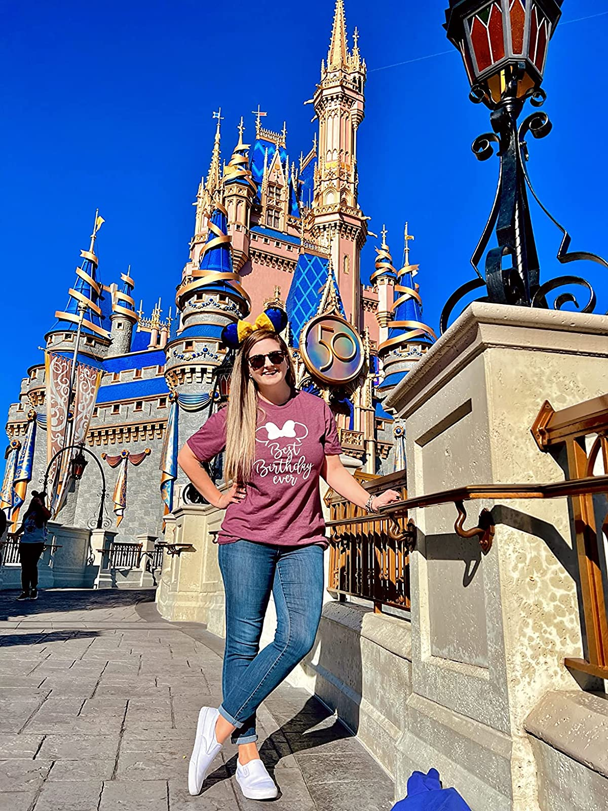 reviewer wearing the achromatic  slip-ons astatine  Disney