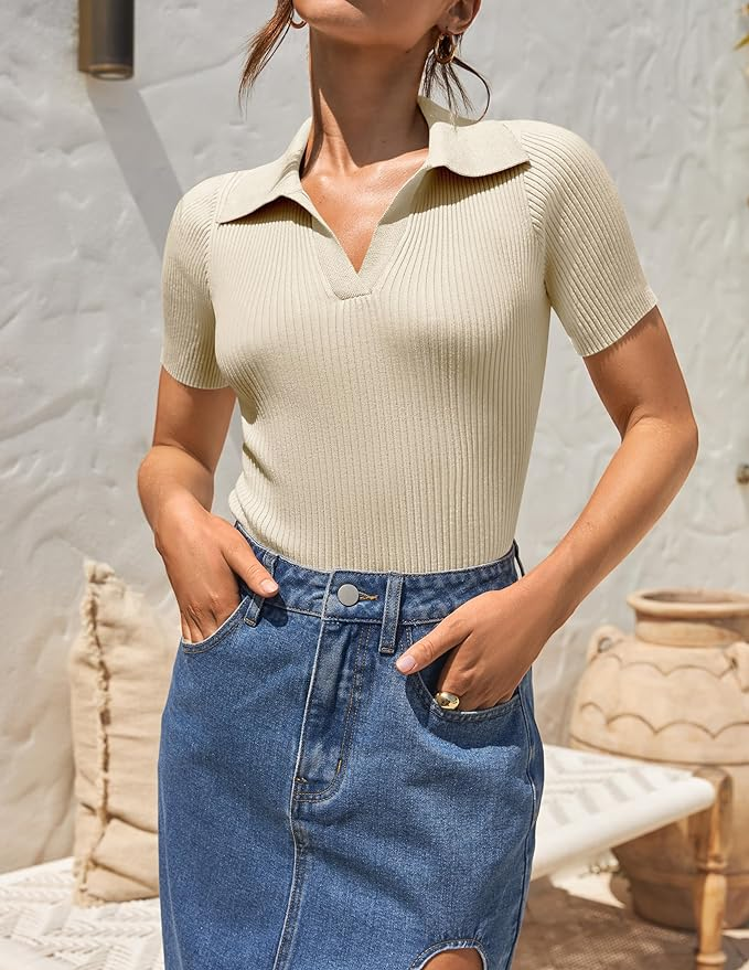 A model wears a fitted short-sleeve sweater shirt and a high-waisted denim skirt