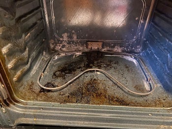 reviewer image of their oven covered in gunk