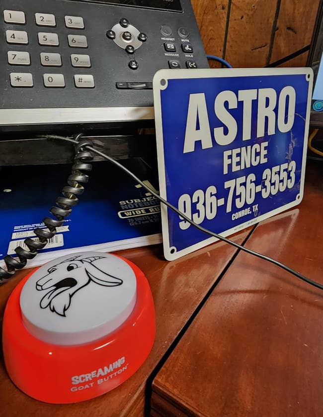 desk with a small red round 