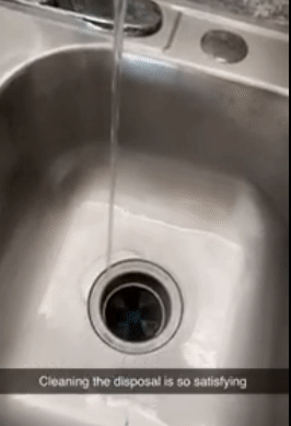 reviewer gif of the garbage disposal cleaner foaming up in a sink with text: cleaning the disposal is so satisfying
