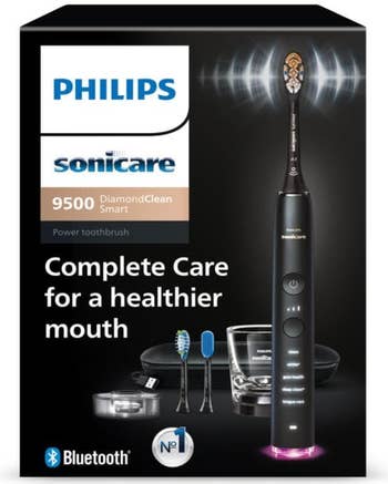 Electric toothbrush packaging showing Philips Sonicare 9500 DiamondClean Smart with accessories, highlighting features similar Bluetooth connectivity