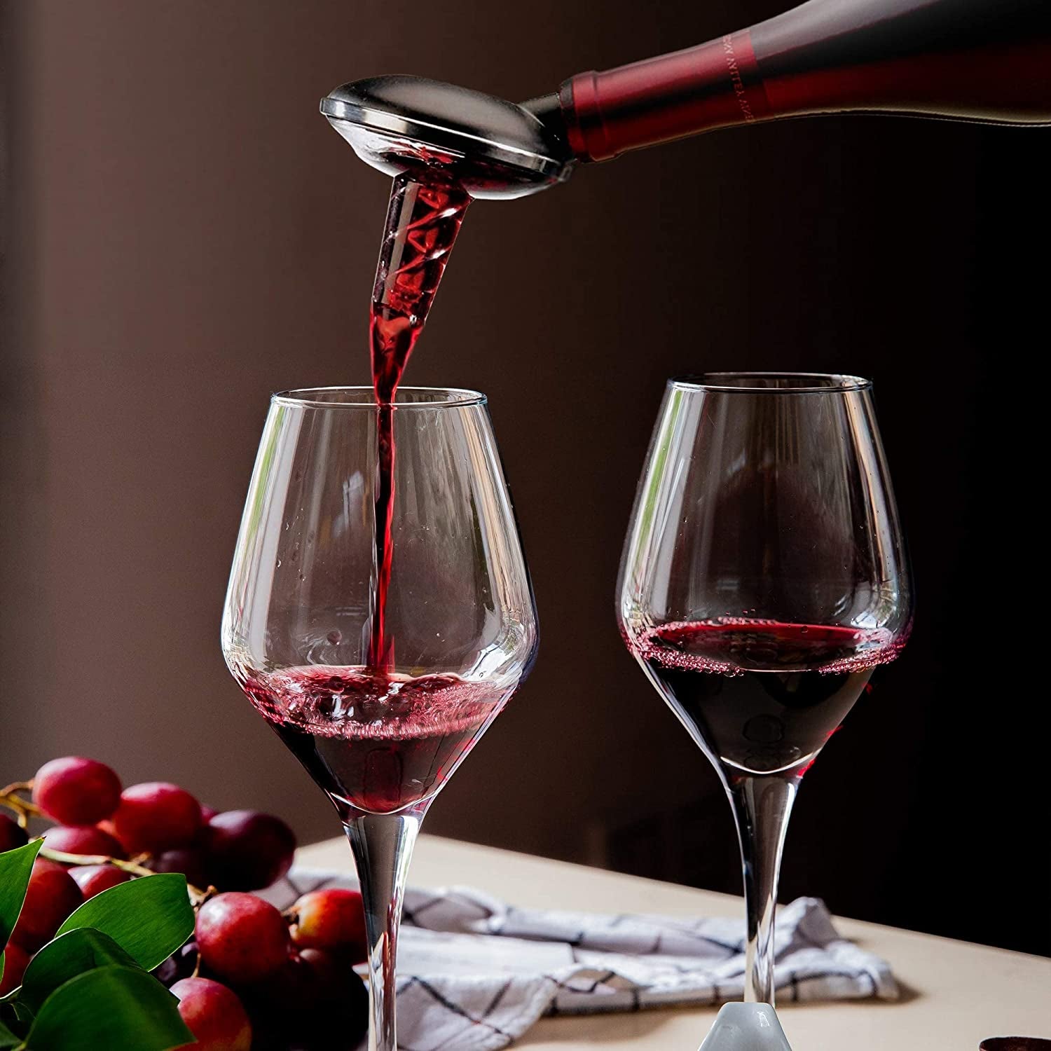 Image of two wine glasses with aerator