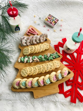 the Christmas tree serving board filled with cookies