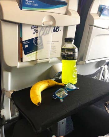tray table pulled down for snacking with the cover over it
