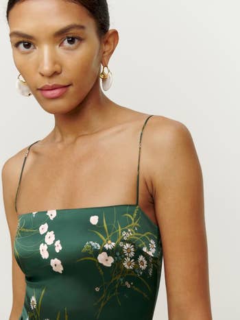 A model wearing the dress in green