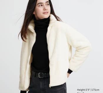 model wearing white jacket unzipped