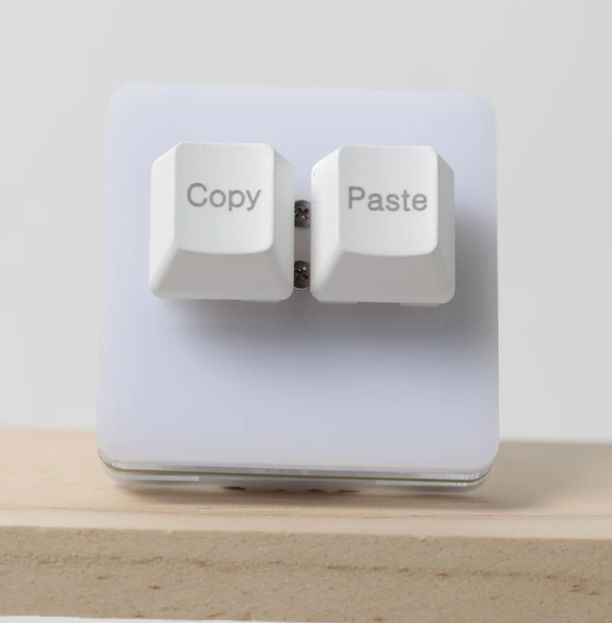 a mini keyboard with two buttons labeled