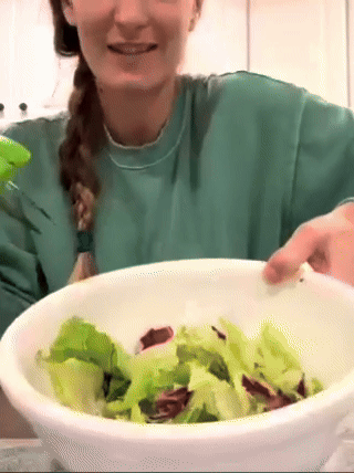 reviewer preparing salad salad scissors 