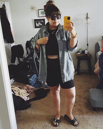 reviewer mirror selfie wearing denim shacket and sunglasses