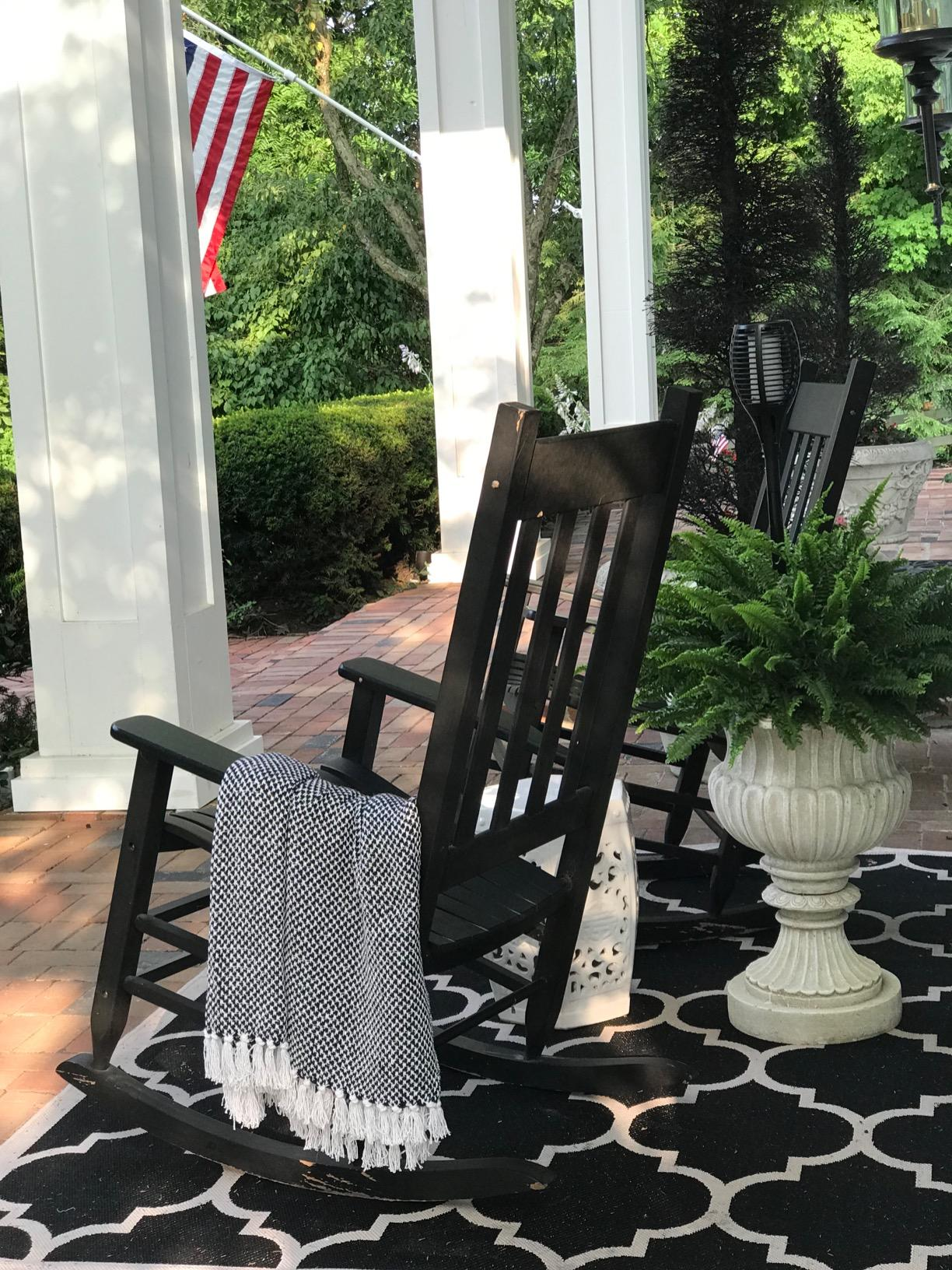 a reviewer photograph  of a rocking seat  connected  a structure  with the broad  successful  achromatic  draped implicit    it 