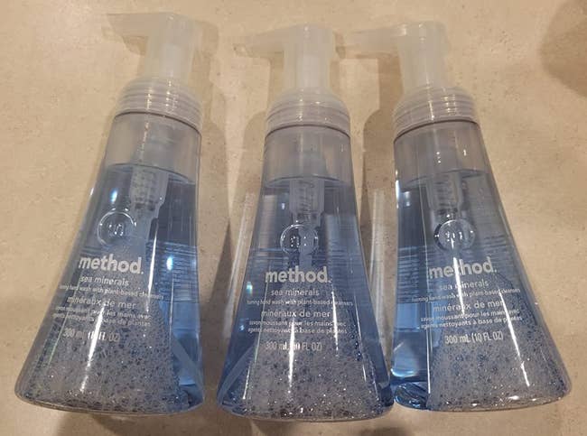 Reviewer image of three blue soap bottles