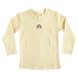 A light yellow toddler's t-shirt with a small rainbow in the center