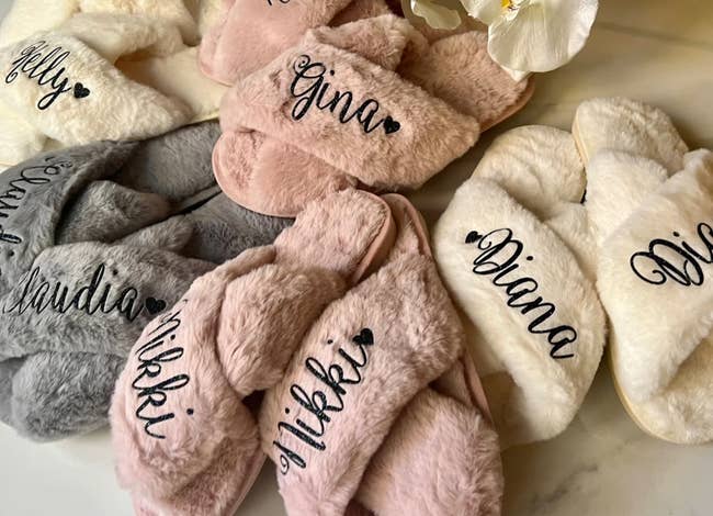 The slippers in various colors personalized with different names 