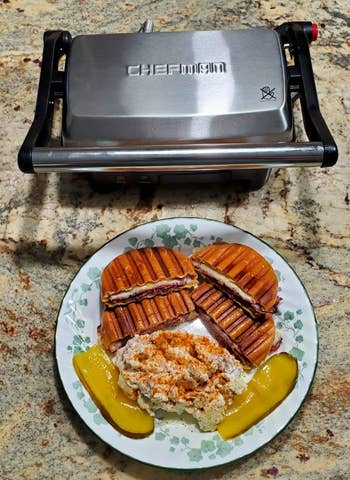 Reviewer image of silver and black grill with plate of food