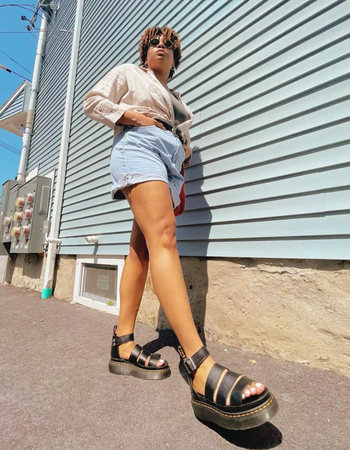 Model wearing the black gladiator sandals