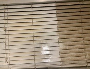 reviewer image of blinds that are half clean and half dusty