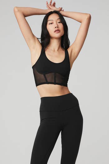 model wearing the black mesh corset bra