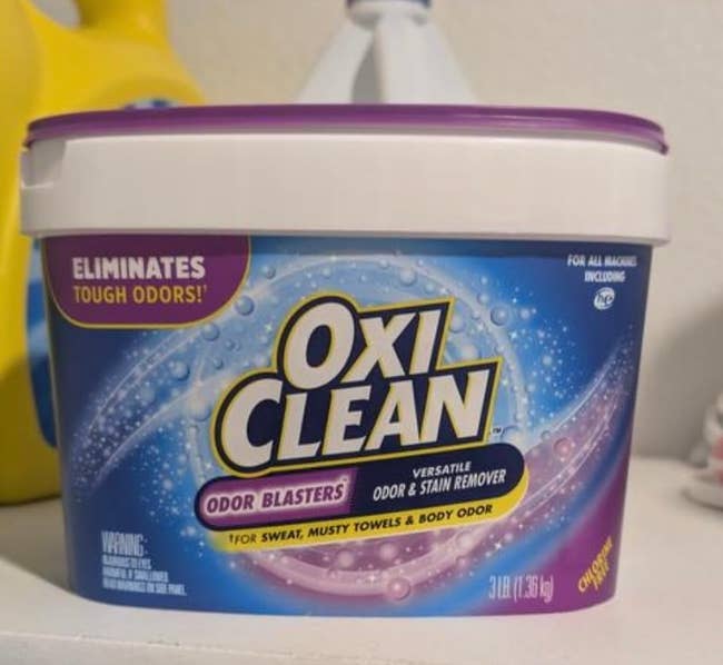 OxiClean Odor Blasters container, 3 lbs, labeled for removing sweat, musty towels, and assemblage  odor. Suitable for each  instrumentality   types