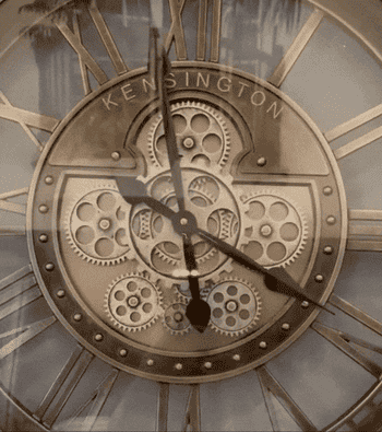 closeup of gears moving inside reviewer's clock 
