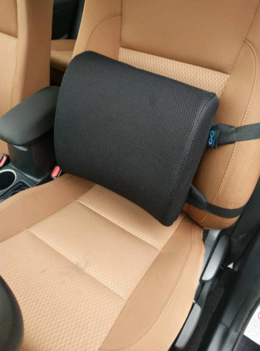the cushion strapped to a car seat
