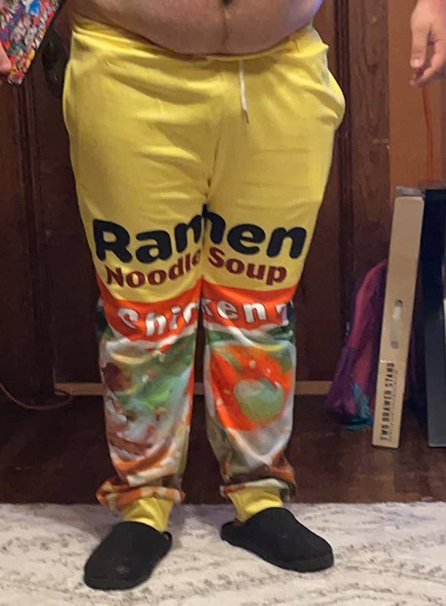 Reviewer wearing chicken ramen noodle sweatpants