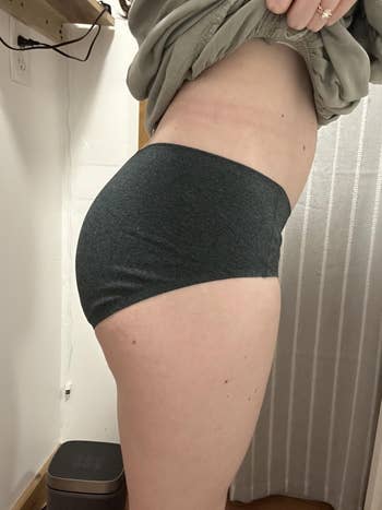 Person successful broadside presumption wearing high-waisted undergarments and a casual top, demonstrating the acceptable and sum of the underwear