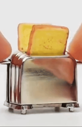 A stainless steel toaster with a single slice of bread popping up
