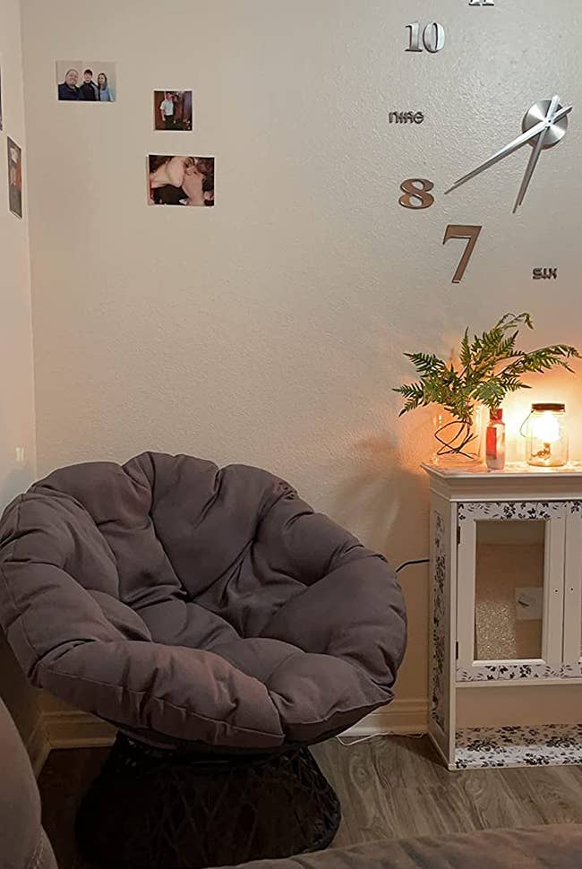 A reviewer's grey mushroom chair in the corner of their room