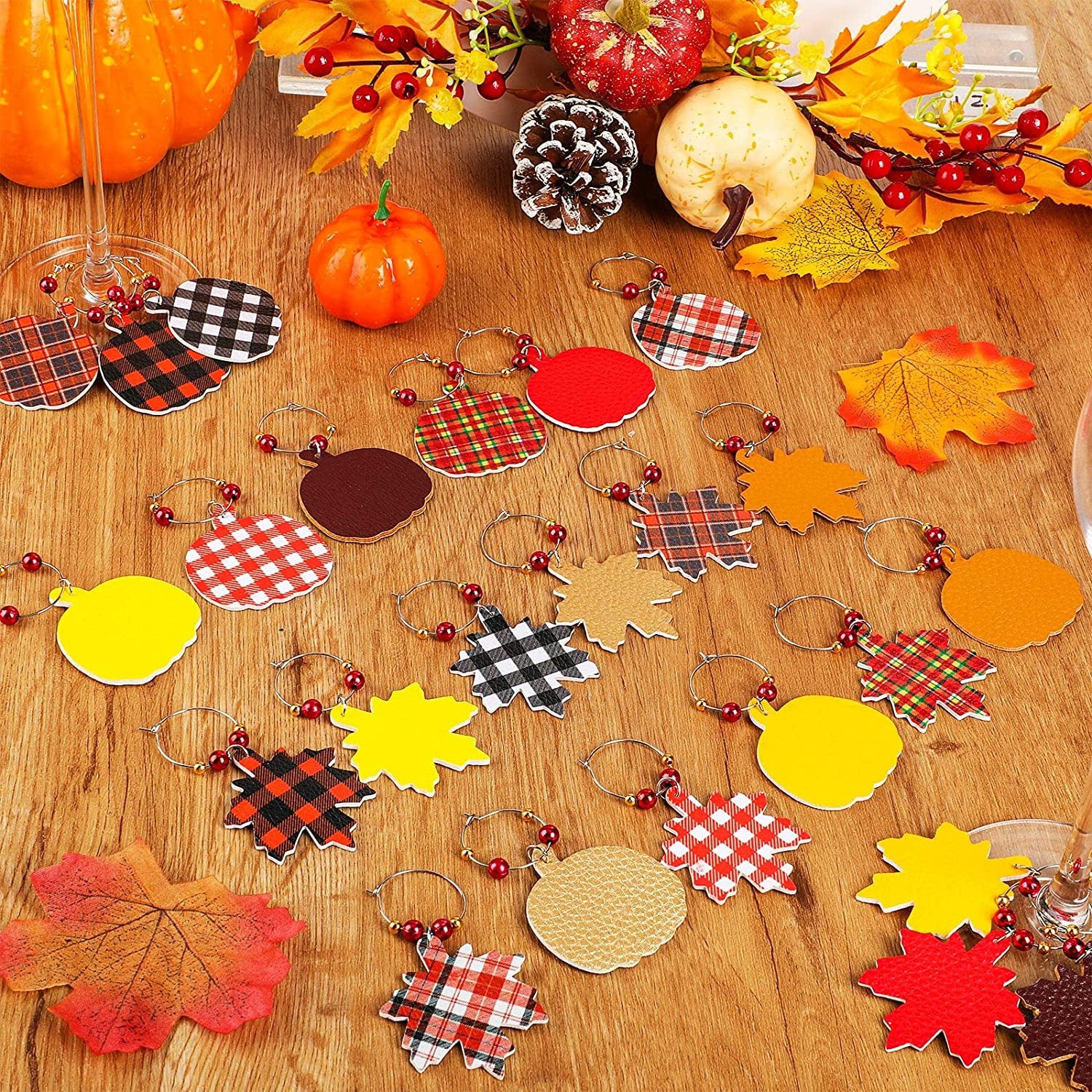 the fall-themed wine glass charms shaped like pumpkins and leaves, and in various plaid and solid colored prints