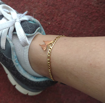 Reviewer wearing the gold butterfly anklet with the initial J