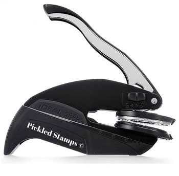 the black embosser with the pickled stamps logo in white lettering on its side
