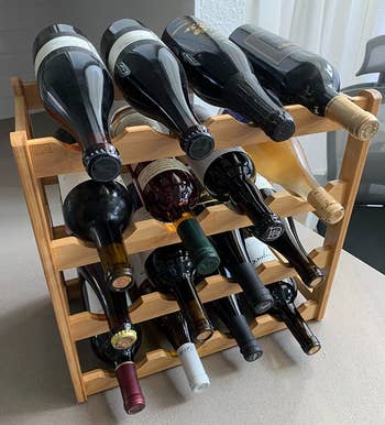 Reviewer image of light brown wine rack with bottles