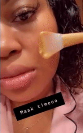 gif of reviewer applying a face mask using the applicator brush with text: mask timeee