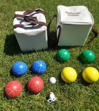 reviewer photo of the complete bocce set on a lawn
