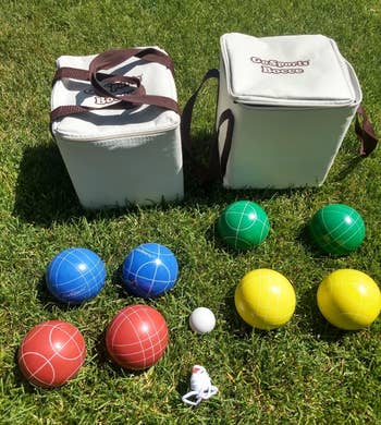 reviewer photo of the complete bocce set on a lawn