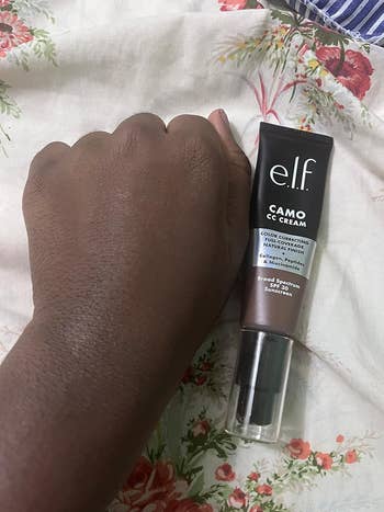 reviewer's manus  adjacent  to elf camo cc cream