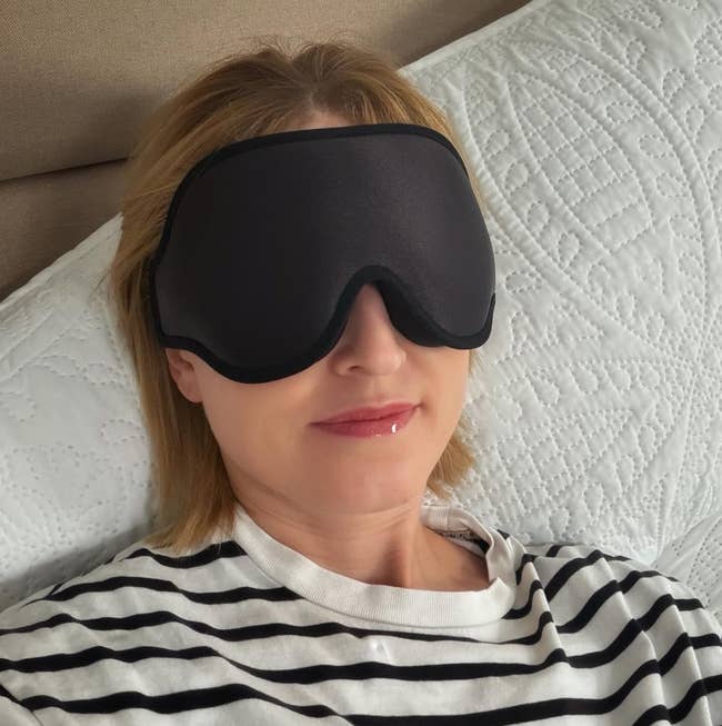person lying down wearing the mask